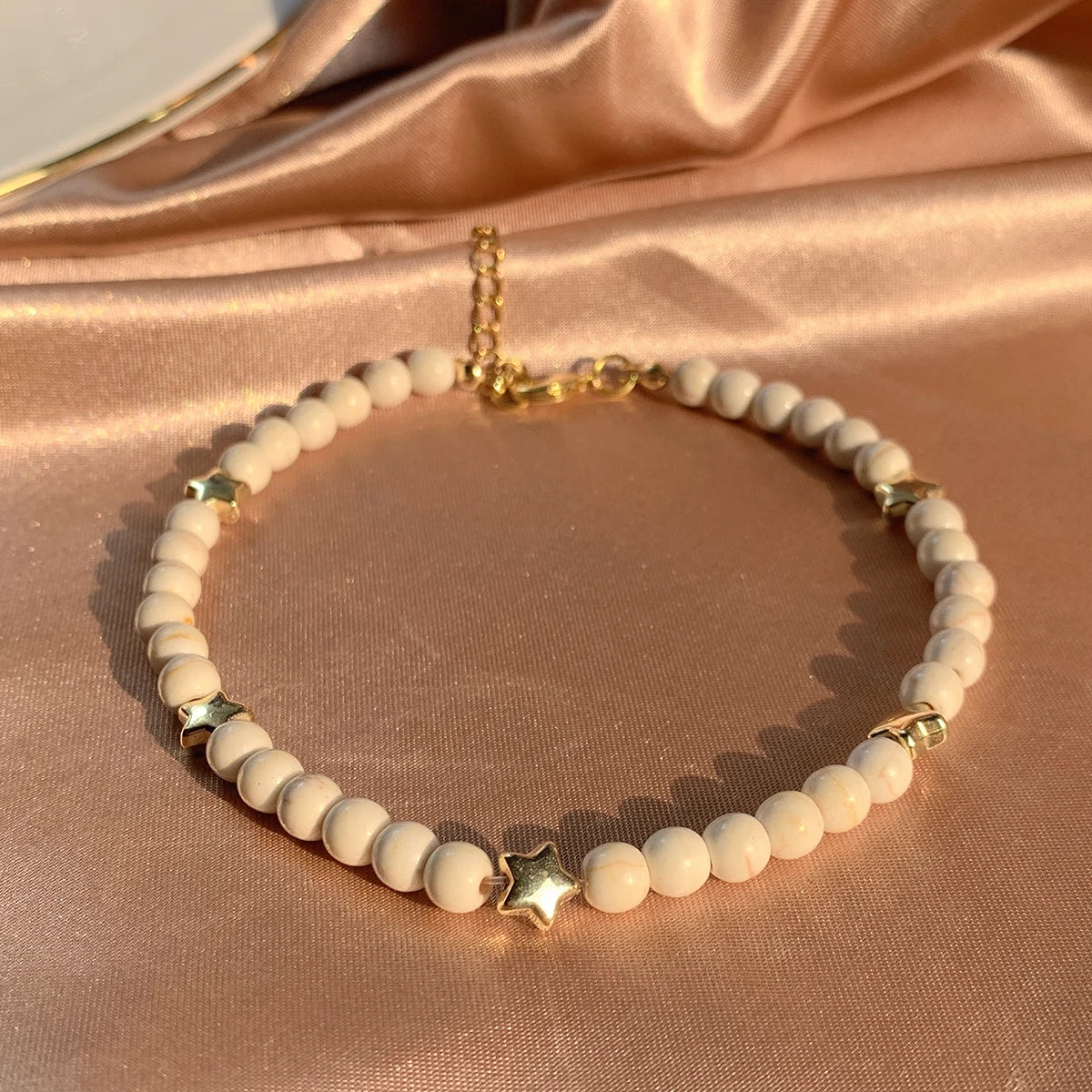 White Bead Bracelet with Golden Hearts
