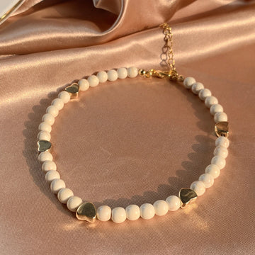 White Bead Bracelet with Golden Hearts